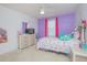 Bedroom with vibrant wall color and coordinated furnishings creating a personalized and inviting atmosphere at 5151 Preserve Blvd, St Cloud, FL 34772
