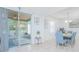 Inviting dining area with views of screened-in patio, light furniture, and modern decor at 5151 Preserve Blvd, St Cloud, FL 34772