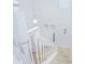 Bright staircase with white railings, neutral carpets and plenty of natural light at 5151 Preserve Blvd, St Cloud, FL 34772