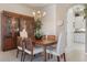 Formal dining area showcasing wood table set, chandelier lighting, and a built in china cabinet at 5560 Squires Dr, Leesburg, FL 34748