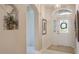 Inviting foyer with arched doorways, tiled floors, and decorative accents at 5560 Squires Dr, Leesburg, FL 34748