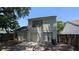Backyard view highlighting a two-story home, patio, and fenced yard at 609 Whittingham Pl, Lake Mary, FL 32746