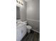 Modern bathroom with a white vanity, new counter top, and sleek dark wood floor at 609 Whittingham Pl, Lake Mary, FL 32746