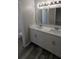 Bathroom featuring dual sinks, modern cabinetry, and stylish lighting at 609 Whittingham Pl, Lake Mary, FL 32746