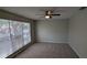 Spacious bedroom with a ceiling fan, neutral paint, and a large window at 609 Whittingham Pl, Lake Mary, FL 32746