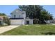 Charming two-story home with a well-maintained lawn and a covered front entry at 609 Whittingham Pl, Lake Mary, FL 32746