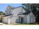 Charming two-story home featuring a two-car garage, gray stucco and dark green door at 609 Whittingham Pl, Lake Mary, FL 32746