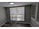 Bright living room featuring modern flooring and a large window with natural light at 609 Whittingham Pl, Lake Mary, FL 32746