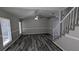 A beautifully designed living room with wood floors, high ceilings, and a staircase at 609 Whittingham Pl, Lake Mary, FL 32746