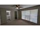 Main bedroom with ceiling fan, bathroom access, walk in closet, and a bright window at 609 Whittingham Pl, Lake Mary, FL 32746