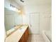 Bathroom features a vanity with a large mirror, and a shower-tub combo at 6169 Metrowest Blvd # 308, Orlando, FL 32835