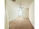 Bright, carpeted bedroom with a ceiling fan and a large window at 6169 Metrowest Blvd # 308, Orlando, FL 32835