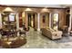 Open living room with decorative columns, detailed walls, and ample space for elegant living and entertaining at 6169 Metrowest Blvd # 308, Orlando, FL 32835