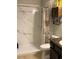 Bathroom featuring a shower with curtain and wooden shelving at 6800 Se 12Th Pl, Ocala, FL 34472