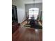 Dining room featuring modern chandelier and table set with six chairs next to a bright window at 6800 Se 12Th Pl, Ocala, FL 34472