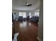 Open living room with hardwood floors, neutral paint, and comfortable seating at 6800 Se 12Th Pl, Ocala, FL 34472