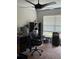 Cozy office space featuring a ceiling fan, desk, and natural light from the window at 6800 Se 12Th Pl, Ocala, FL 34472