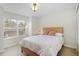 Bedroom with carpet and a large window at 6941 Piazza St, Orlando, FL 32819