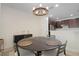 Dining area featuring modern lighting, neutral walls, and seating for four at 6941 Piazza St, Orlando, FL 32819