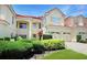 Beautiful home featuring a tile roof, a two car garage, and immaculate landscaping at 6941 Piazza St, Orlando, FL 32819