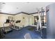 Community gym featuring treadmills, weights, a mirrored wall, and blue carpeting at 6941 Piazza St, Orlando, FL 32819