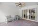 A covered patio with brick floors features seating and a ceiling fan at 6941 Piazza St, Orlando, FL 32819