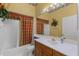 Bathroom with framed mirror, garden-style tub and colorful decor at 6955 Della Dr # 41, Orlando, FL 32819