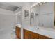 Spacious bathroom with double sinks, framed mirrors, and tile flooring at 6955 Della Dr # 41, Orlando, FL 32819