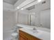 Well-lit bathroom featuring a large mirror, shower, and tub at 6955 Della Dr # 41, Orlando, FL 32819