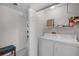 Bright laundry area with washer and dryer, storage shelf, and doorway to the rest of the house at 6955 Della Dr # 41, Orlando, FL 32819