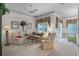 Bright living room with comfortable seating, large windows, and a ceiling fan at 6955 Della Dr # 41, Orlando, FL 32819