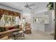 Bright living room with ceiling fan and large windows offering plenty of natural light at 6955 Della Dr # 41, Orlando, FL 32819