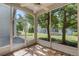 Screened porch with tile floor overlooking well-manicured backyard and tropical landscaping at 6955 Della Dr # 41, Orlando, FL 32819