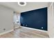 Bright bedroom featuring light wood floors, fresh paint and bright, filtered, natural light at 6969 Edgeworth Dr, Orlando, FL 32819