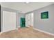 Simple bedroom featuring tiled flooring, a closet and an open doorway at 6969 Edgeworth Dr, Orlando, FL 32819