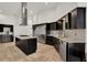 Modern kitchen featuring stainless steel appliances, granite countertops, and ample storage at 6969 Edgeworth Dr, Orlando, FL 32819