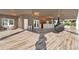 Covered lanai with bar area, pendant lights, and a unique egg-shaped swing at 6969 Edgeworth Dr, Orlando, FL 32819