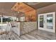 This outdoor bar features stone accents, wood detailing, and a unique design, perfect for entertaining guests at 6969 Edgeworth Dr, Orlando, FL 32819