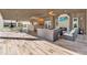 Spacious outdoor living area with fireplace, bar, and comfortable seating, ideal for relaxation and entertainment at 6969 Edgeworth Dr, Orlando, FL 32819