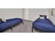 Comfortable bedroom with carpet, bright walls and two twin beds at 7263 Oakmoss Loop, Davenport, FL 33837