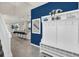 Spacious entryway with coat storage, tiled flooring, and open access to the kitchen at 7263 Oakmoss Loop, Davenport, FL 33837