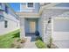 Close up of the home's front porch featuring stylish brickwork and a bright entryway at 7263 Oakmoss Loop, Davenport, FL 33837