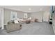 Cozy living room area with large windows and comfortable seating at 7263 Oakmoss Loop, Davenport, FL 33837