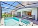 Enjoy this beautiful screened pool and spa, creating a private oasis for relaxation and recreation at 7263 Oakmoss Loop, Davenport, FL 33837
