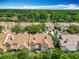 Aerial view showcasing a community with mature trees, manicured lawns and serene surroundings at 7323 Cypress Grove Rd # 87, Orlando, FL 32819