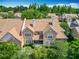 An aerial view of homes with tile roofs and lush landscaping at 7323 Cypress Grove Rd # 87, Orlando, FL 32819