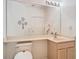 Bathroom with a toilet, sink, vanity and large mirror, creating a functional space at 7323 Cypress Grove Rd # 87, Orlando, FL 32819