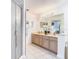 Bright bathroom featuring a double sink vanity with modern fixtures and a walk-in shower at 7323 Cypress Grove Rd # 87, Orlando, FL 32819