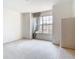A bright and spacious carpeted bedroom with a window at 7323 Cypress Grove Rd # 87, Orlando, FL 32819