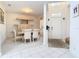 Elegant dining room featuring decorative columns, tile floors, and ample natural light at 7323 Cypress Grove Rd # 87, Orlando, FL 32819